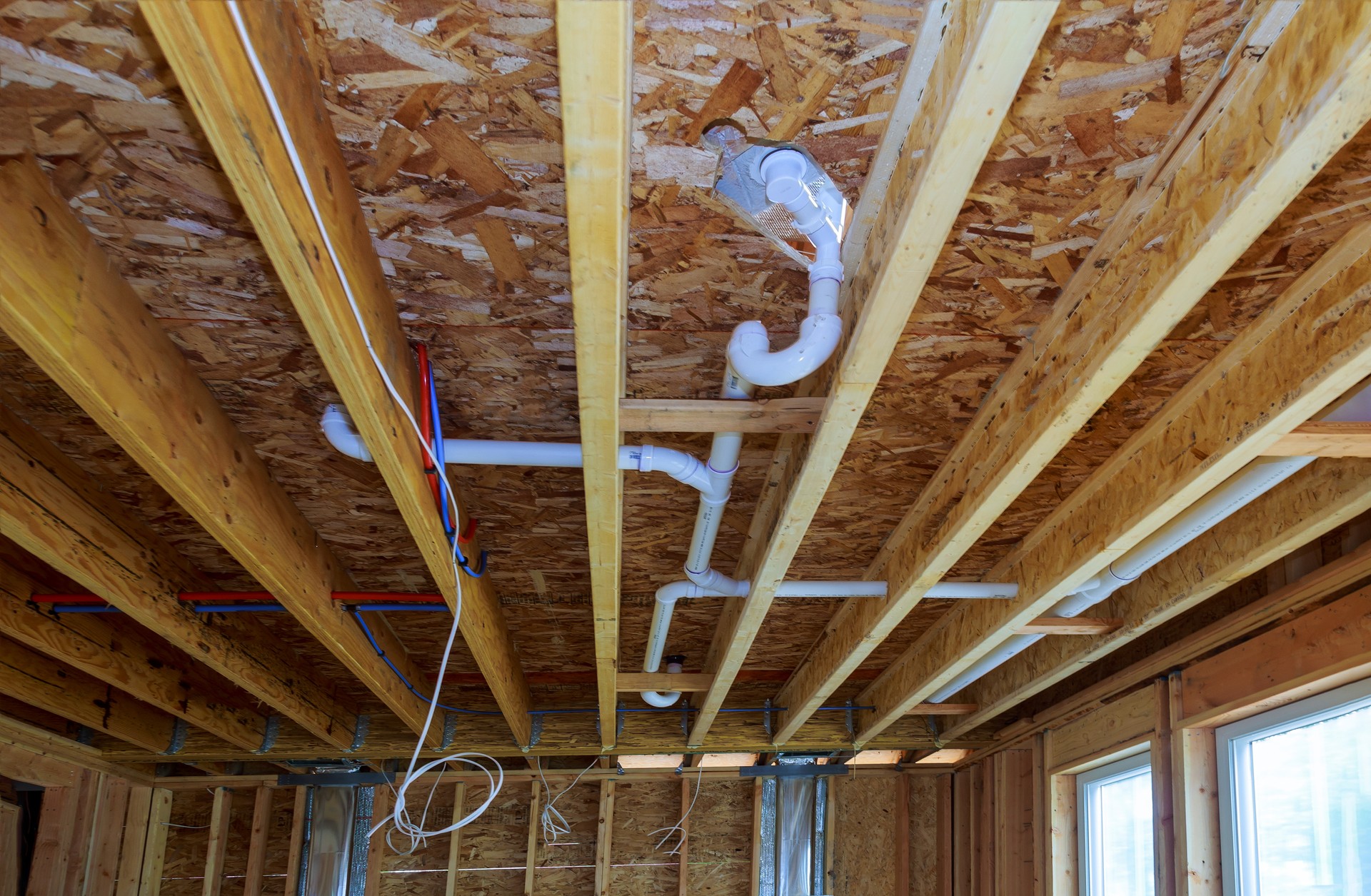 Waste PVC pipe drainage system inside building, piping on the ceiling